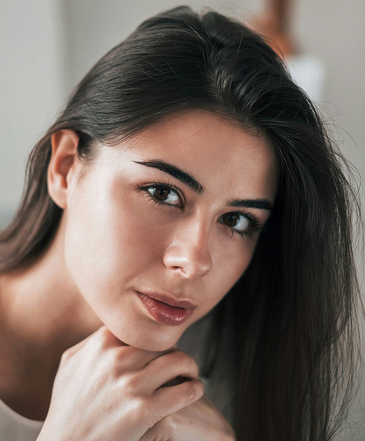 Close-up of a Melbourne facial balancing model's face with soft expression.