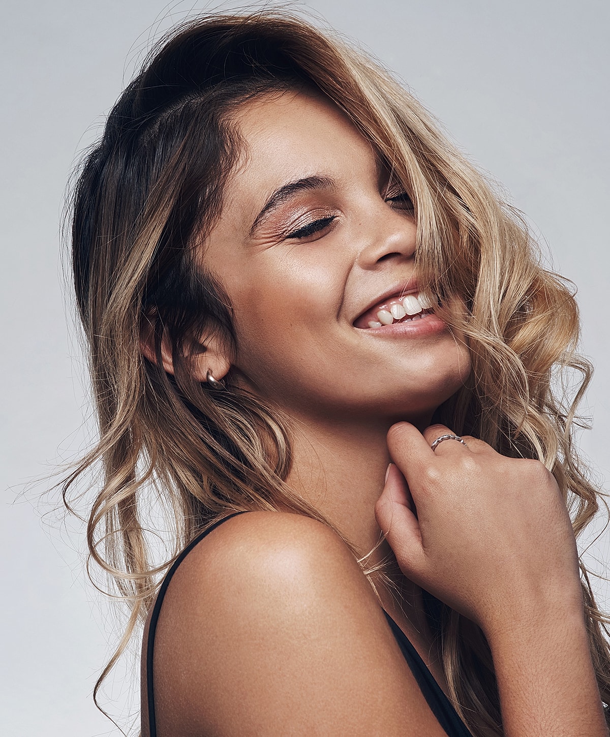 Smiling young Melbourne PRP model with wavy hair.