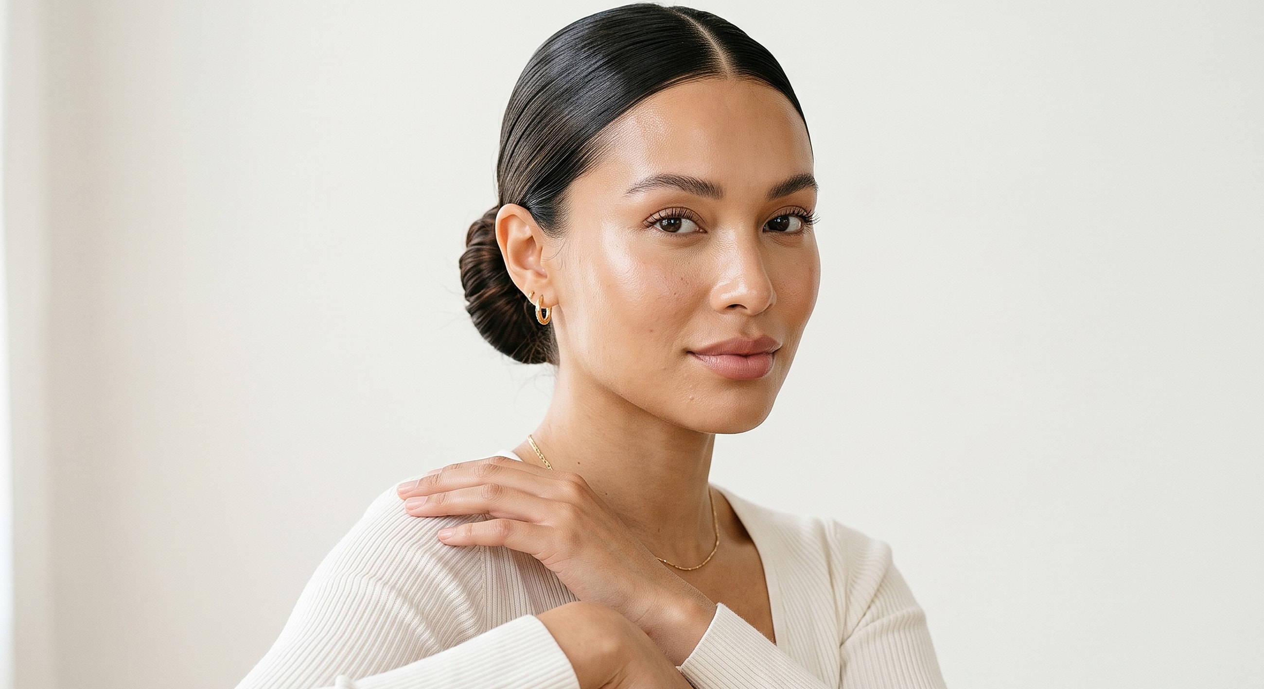 Melbourne dermal filler model in natural light with elegant hairstyle.